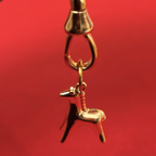 year of the horse gold charm on red background
