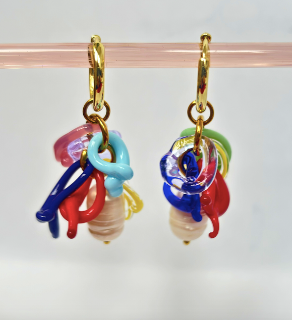 Colorful glass bead earrings on a clear background