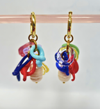 Colorful glass bead earrings on a clear background