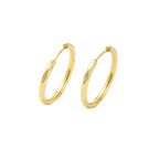 Gold hoop earrings on a white background